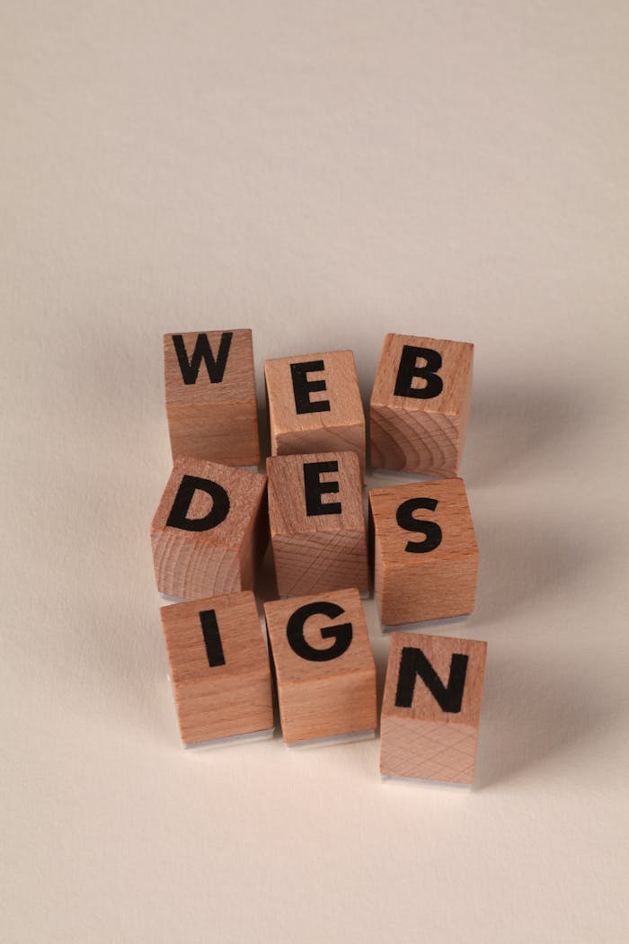 about-01 Wooden blocks arranged to spell Web Design. Perfect for creative, digital content themes.